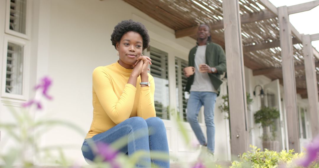 Couple Enjoying Leisurely Morning on Porch in Rustic Setting
