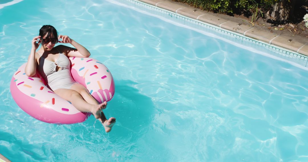 Relaxing at Poolside on Donut Float with Sunglasses