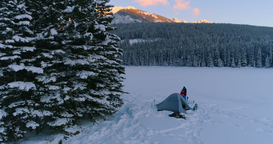 Winter Camping in Snowy Mountain Landscape at Sunset - Free Images, Stock Photos and Pictures on Pikwizard.com