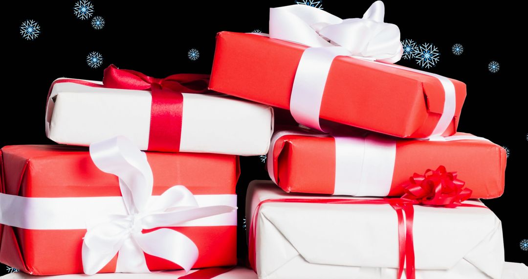 Festive Stack of Red and White Holiday Presents with Snowflakes