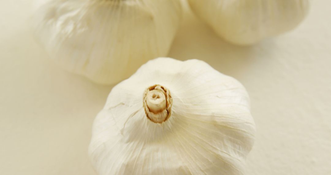 Organic Garlic Bulbs on White Background - Free Images, Stock Photos and Pictures on Pikwizard.com