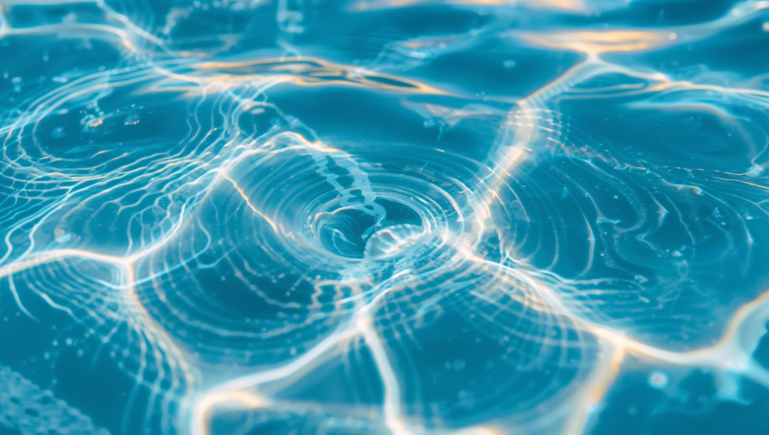 Shimmering Turquoise Pool Water with Sunlit Ripples