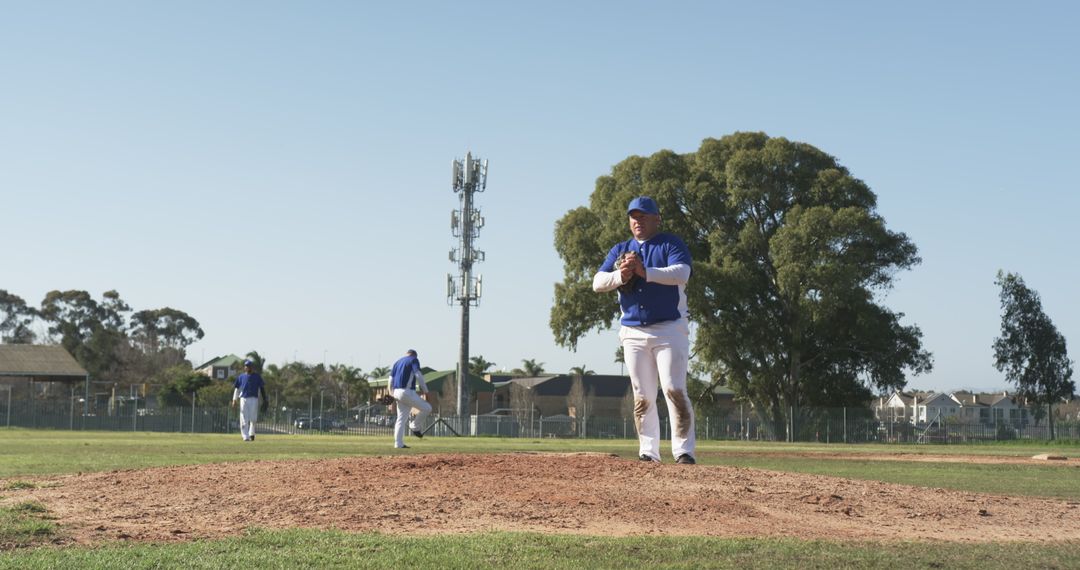 Baseball Team Prepares on Mound Under Clear Skies