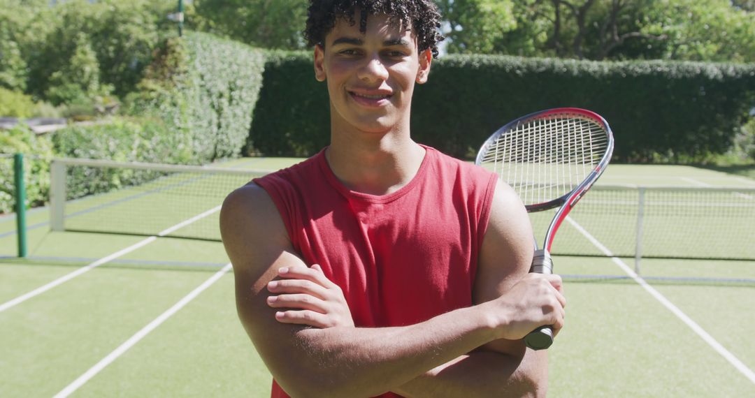 Confident Teen Tennis Player Holding Racket on Outdoor Court - Free Images, Stock Photos and Pictures on Pikwizard.com