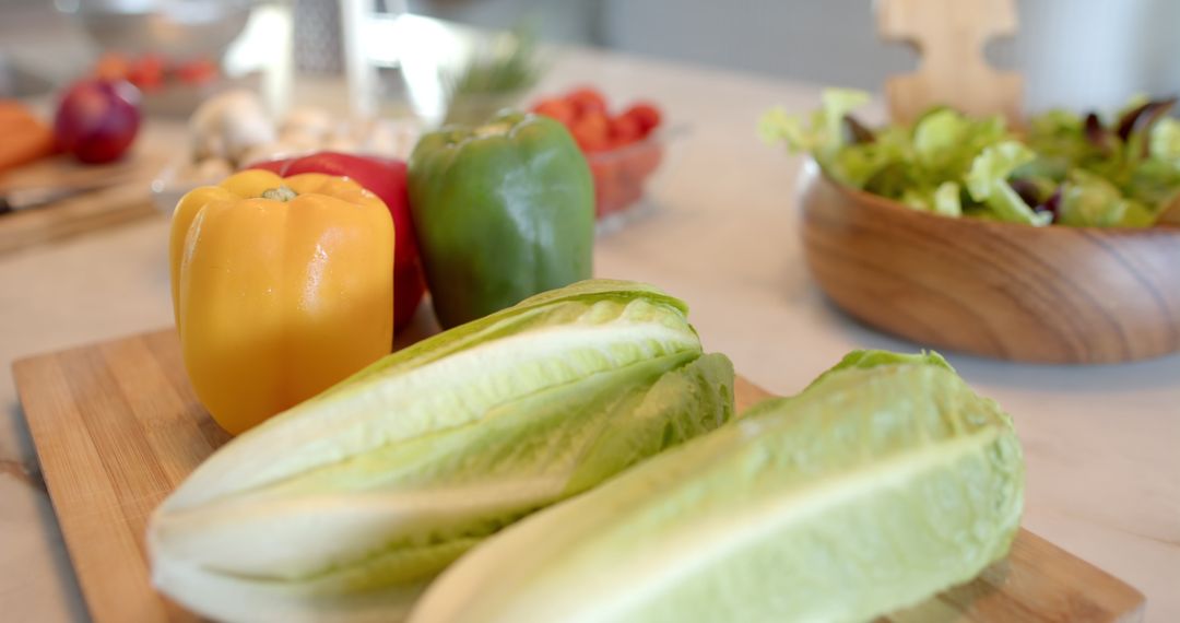 Fresh Romaine and Colorful Vegetables on Wood Board