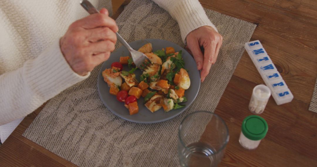 Elderly Woman Eating Healthy Salad at Home - Free Images, Stock Photos and Pictures on Pikwizard.com