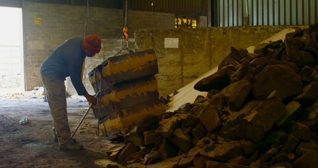 Worker Moving Heavy Materials in Industrial Warehouse - Free Images, Stock Photos and Pictures on Pikwizard.com