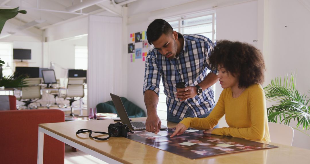 Creative Team Collaborating on Photo Project in Modern Office