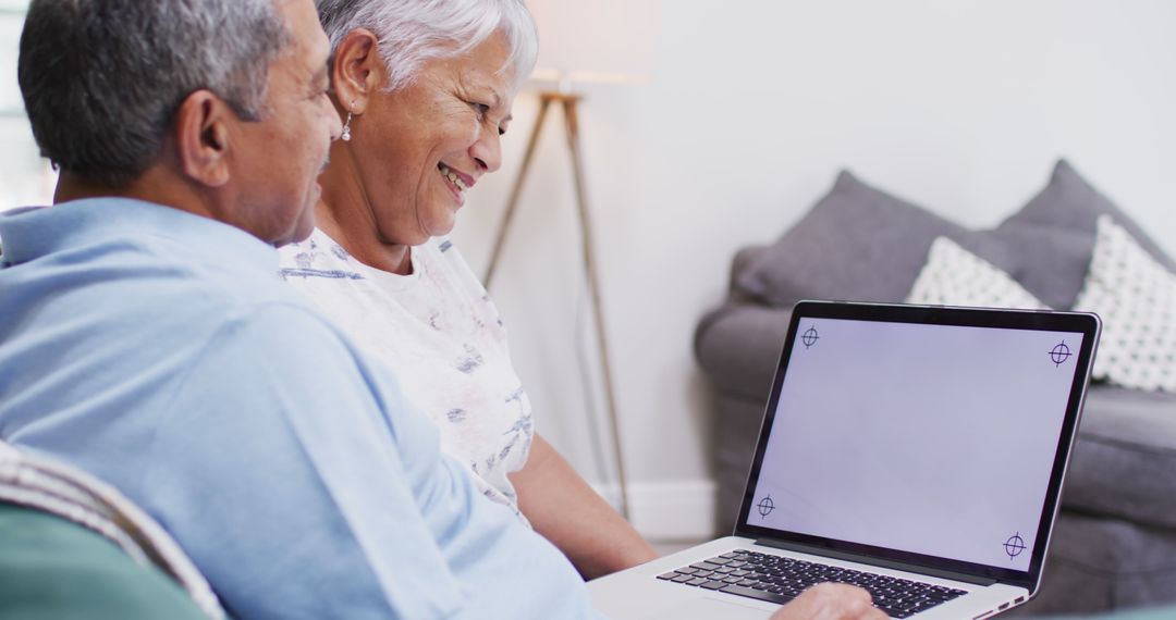 Senior Couple Video Calling with Empty Screen Space at Home