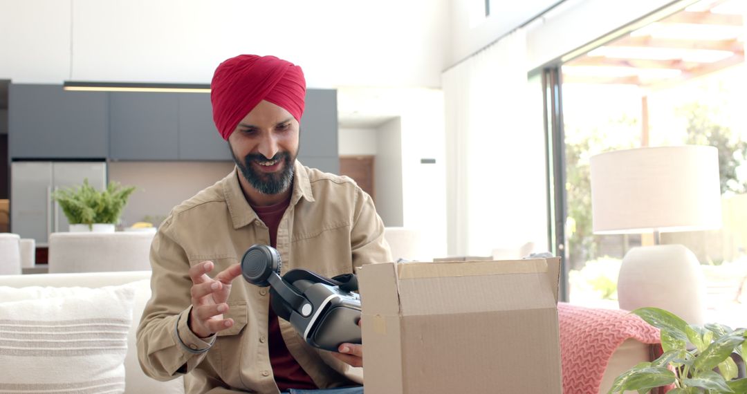 Man Unboxing Virtual Reality Headset at Home with Enthusiasm