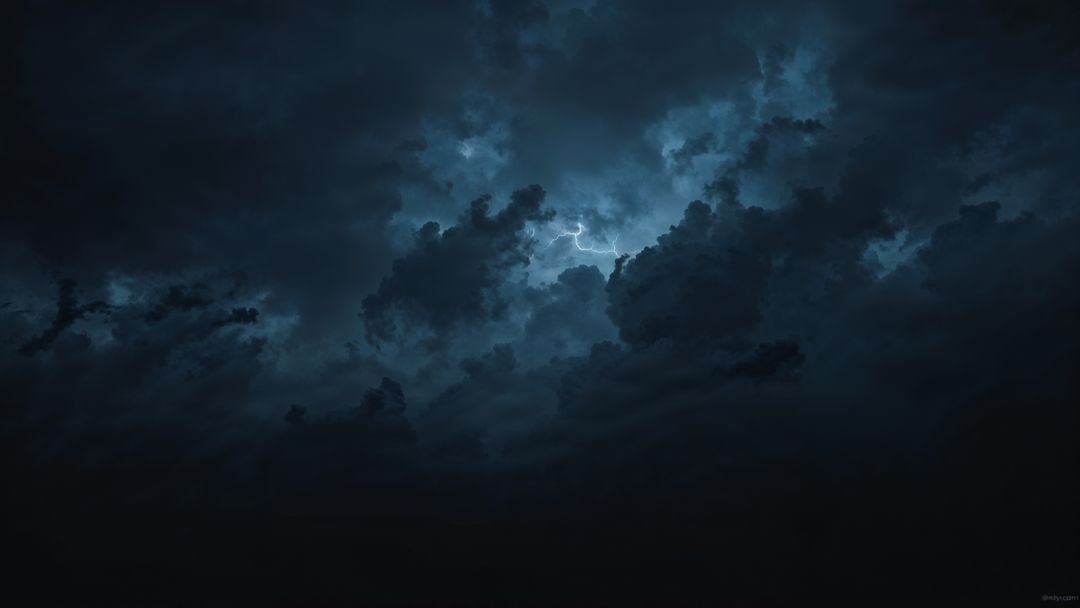 Lightning flash across dark negative energy silhouette cumulonimbus clouds at night