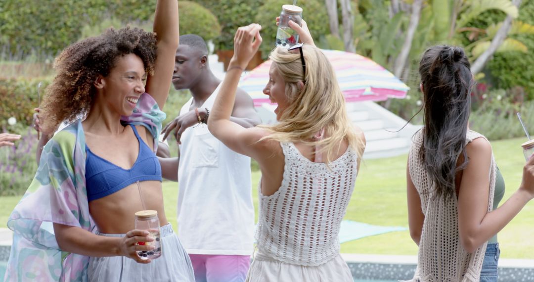 Diverse Friends Dancing at Summer Garden Party Extravaganza