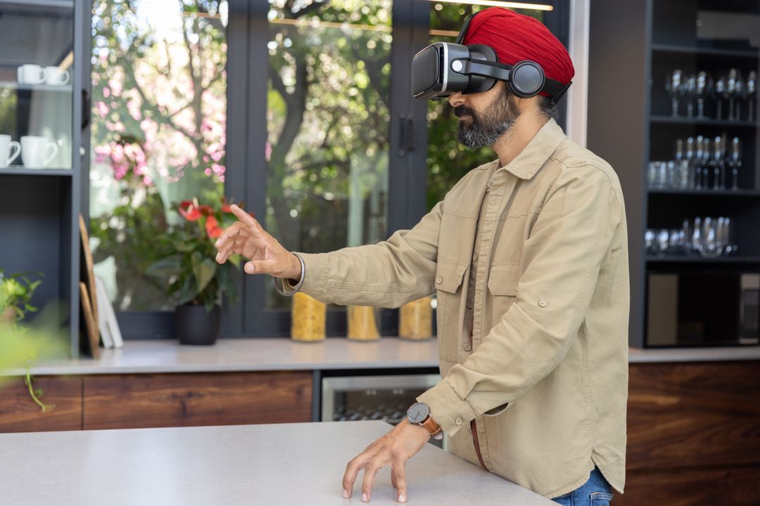 Man Interacting with Virtual Reality in Stylish Kitchen Space