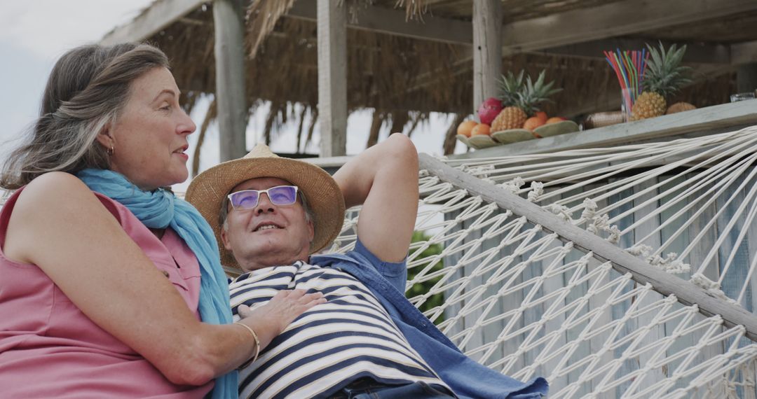 Senior Couple Relaxing in Hammock on Tropical Vacation - Free Images, Stock Photos and Pictures on Pikwizard.com