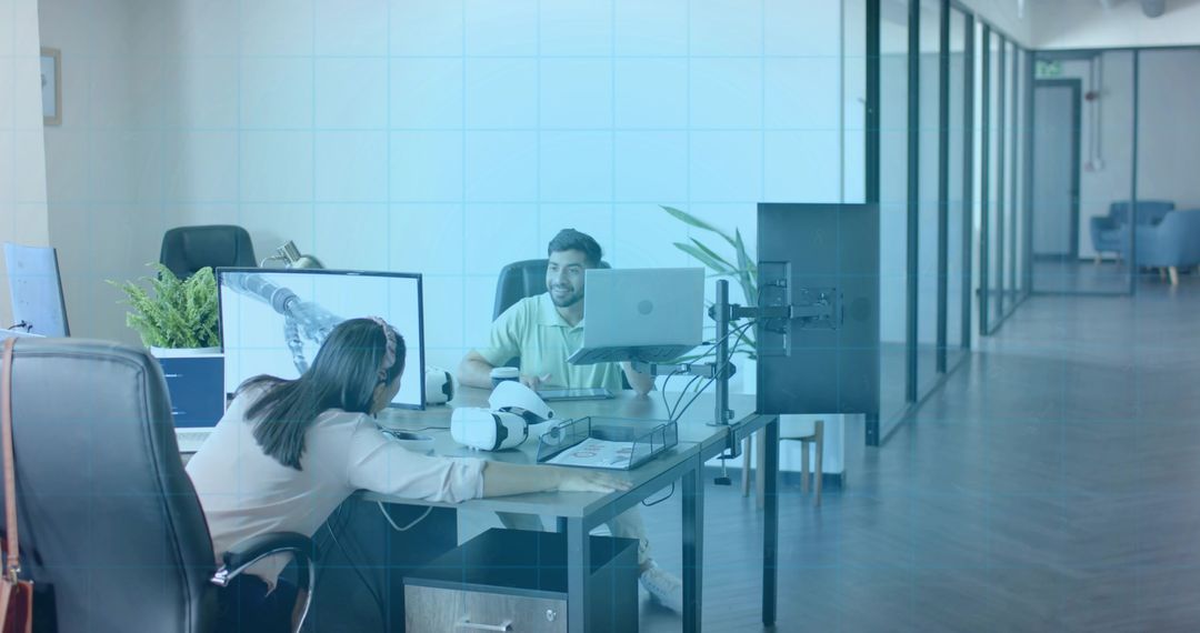 Colleagues Collaborating in Modern Tech Office with VR Equipment
