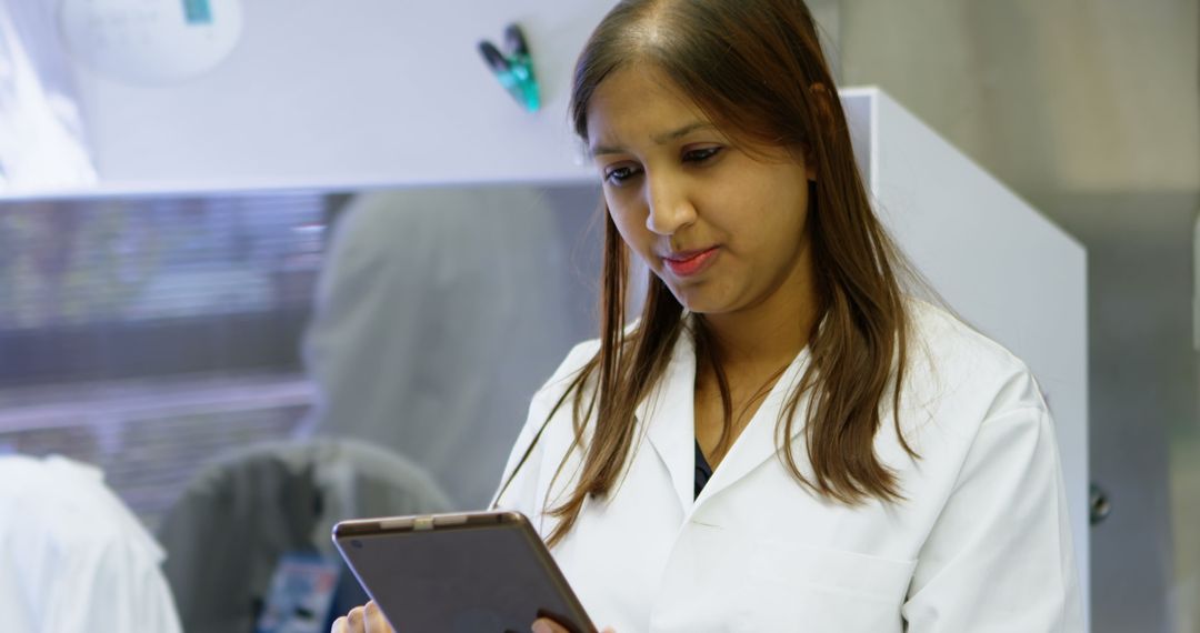 Female Scientist Using Digital Tablet in Modern Laboratory