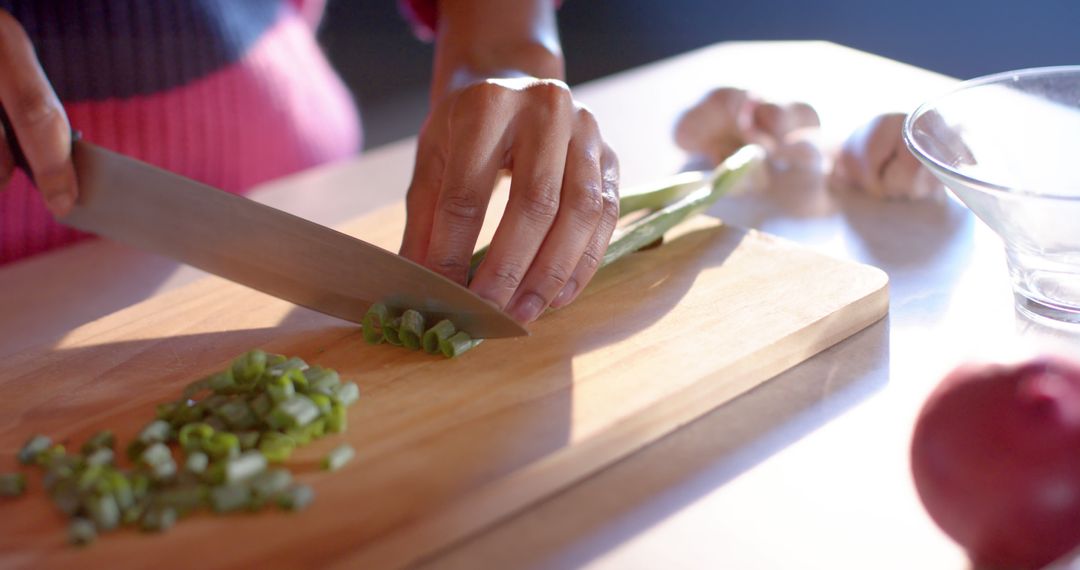 Woman's Hands Chopping Green Onions on Cutting Board - Free Images, Stock Photos and Pictures on Pikwizard.com