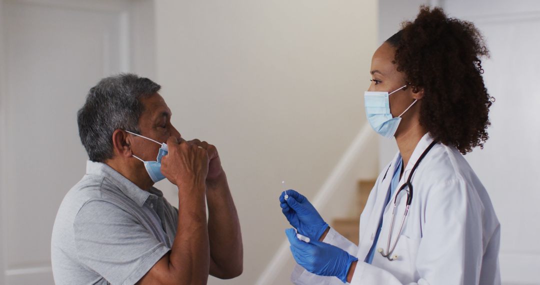 Senior Man Removing Mask in Front of Healthcare Worker - Free Images, Stock Photos and Pictures on Pikwizard.com