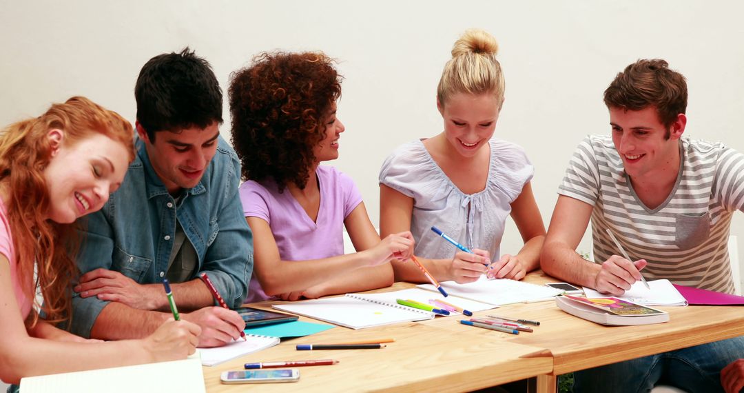 Diverse Group of Students Studying Together at Table - Free Images, Stock Photos and Pictures on Pikwizard.com