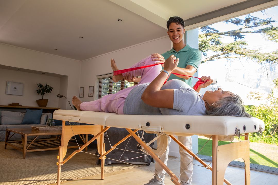 Senior Getting Leg Therapy at Home with Resistance Band