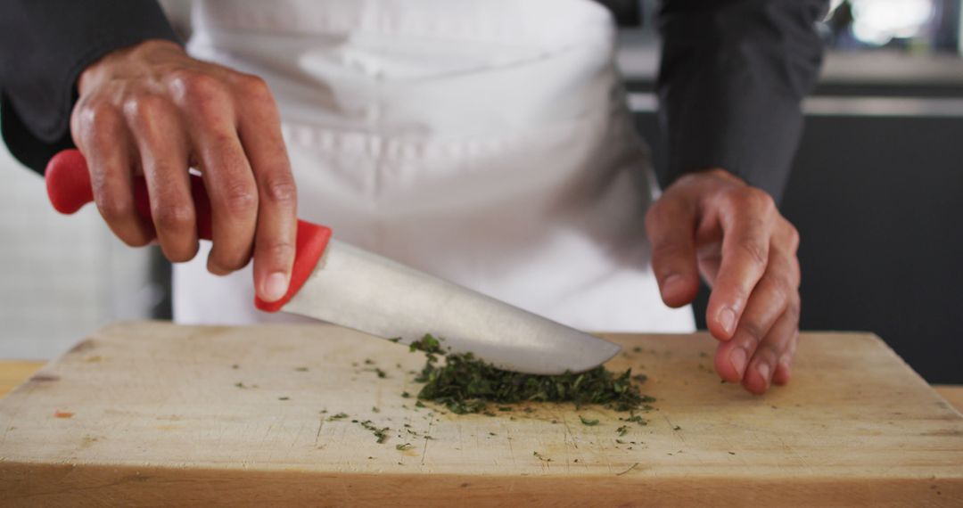 Chef Chopping Fresh Herb Leaves in Modern Kitchen - Free Images, Stock Photos and Pictures on Pikwizard.com