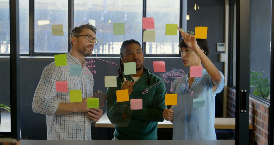 Collaborative Team Planning with Sticky Notes in Modern Office