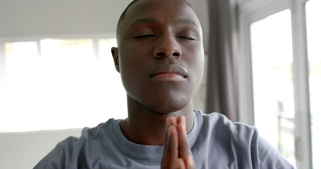 Man Practicing Yoga Meditation Indoors for Wellbeing - Free Images, Stock Photos and Pictures on Pikwizard.com