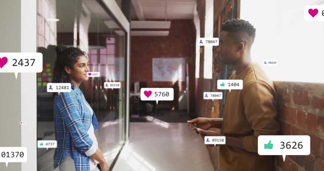 Colleagues Engaging in Digital Media Networking at Modern Workplace