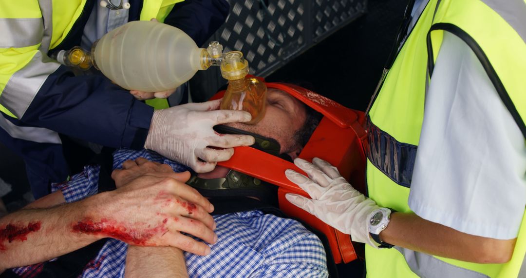 EMTs Providing Rescue Breathing for Injured Man - Free Images, Stock Photos and Pictures on Pikwizard.com