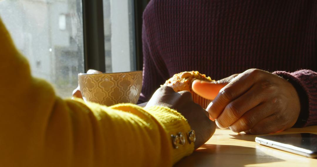 Close-up of Two People Enjoying Coffee and Muffin at Cafe - Free Images, Stock Photos and Pictures on Pikwizard.com