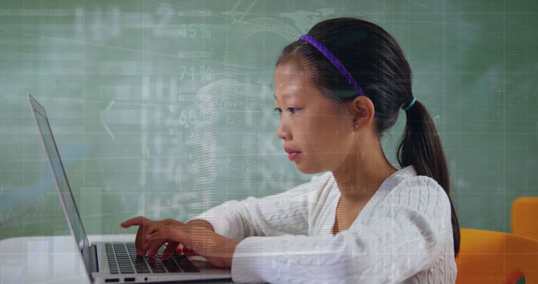 Focused Girl Using Laptop for Online Learning
