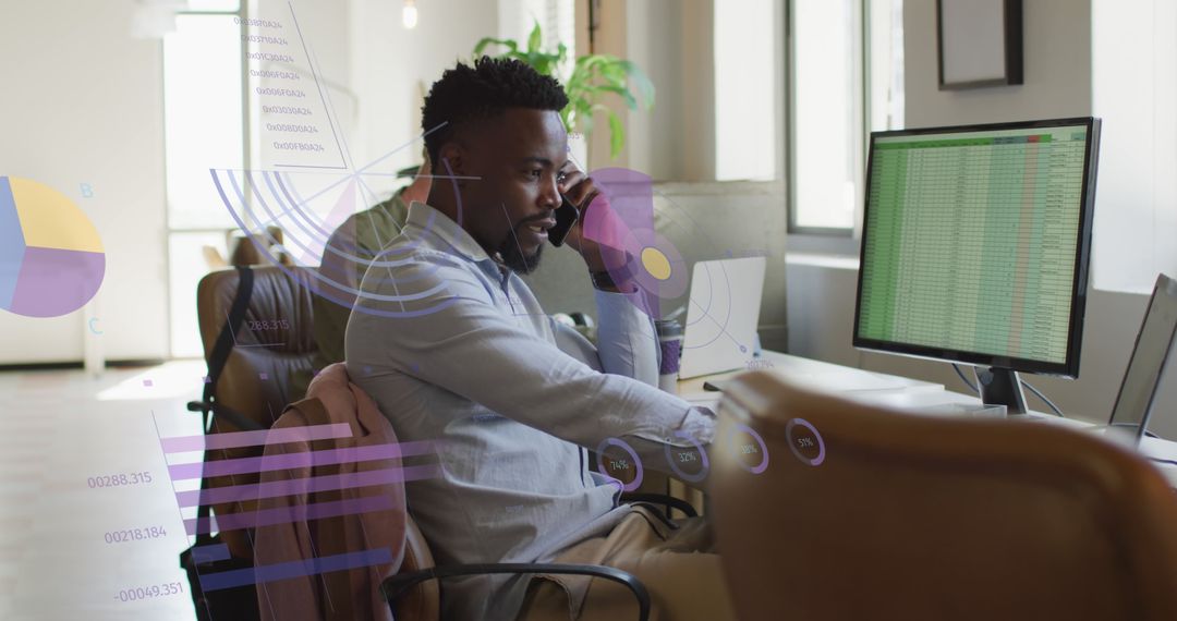 African American Businessman Analyzing Data on Computer in Modern Office