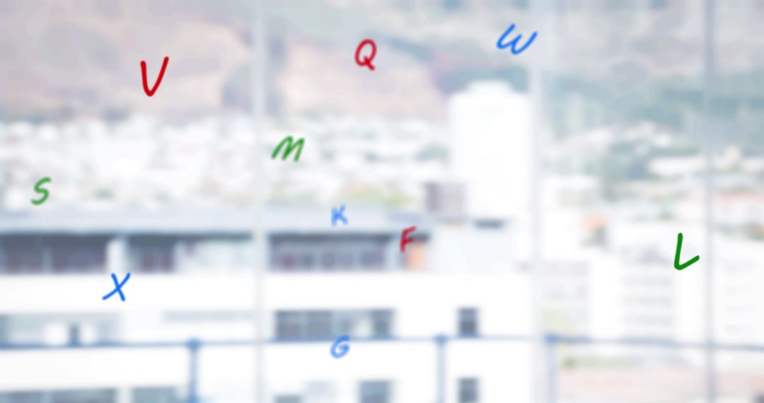 Floating Colored Letters Over Blurred Urban Landscape