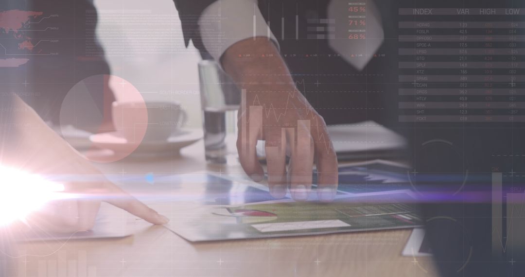 Business Team Analyzing Financial Data And Graphs