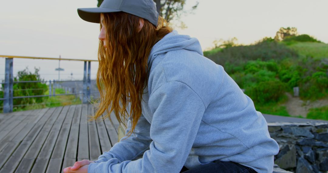 Teen Contemplating Outdoors in Casual Clothing - Free Images, Stock Photos and Pictures on Pikwizard.com