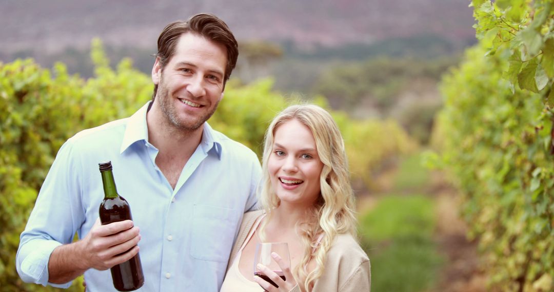 A Caucasian couple enjoys a wine tasting experience in a vineyard, with copy space - Free Images, Stock Photos and Pictures on Pikwizard.com