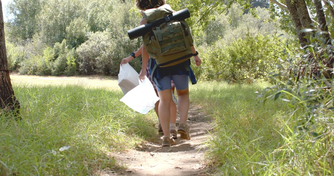 Backpacker Adventurer Exploring Scenic Forest Trail