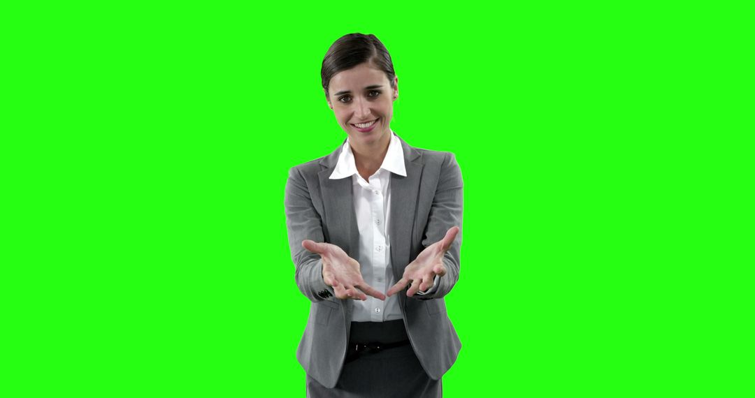 Confident Businesswoman Gesturing Towards Camera on Green Screen - Free Images, Stock Photos and Pictures on Pikwizard.com