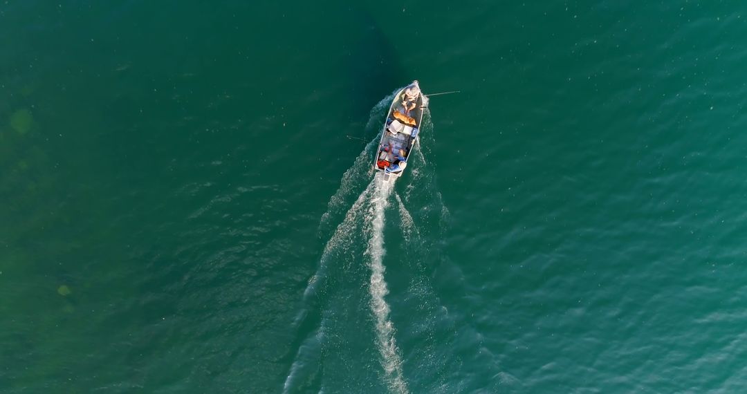 Aerial View of Fishing Boat Sailing in Clear Blue Sea - Free Images, Stock Photos and Pictures on Pikwizard.com