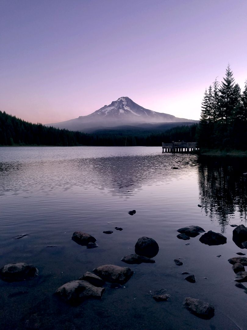 Tranquil Mountain Lake at Sunset with Snow-Capped Mountain - Free Images, Stock Photos and Pictures on Pikwizard.com