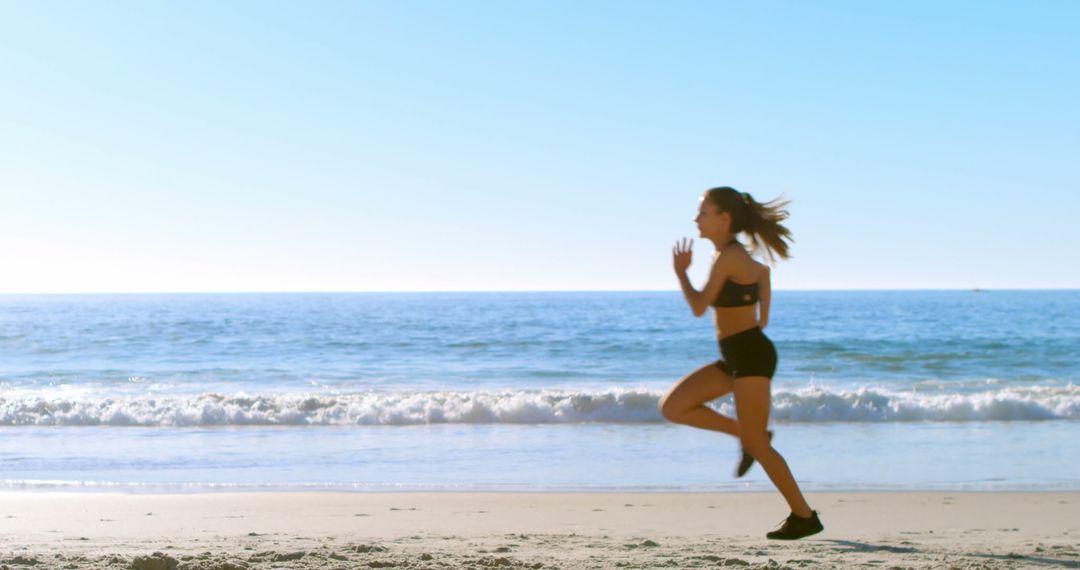 Woman jogging on the beach, with copy space - Free Images, Stock Photos and Pictures on Pikwizard.com