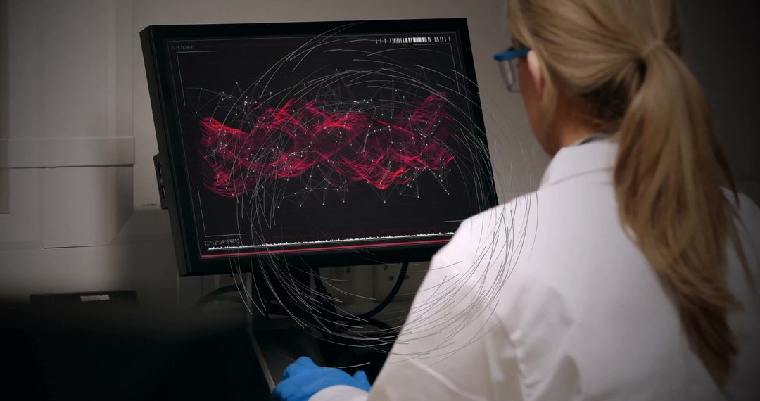 Female Scientist Analyzing Digital Data on Computer Monitor