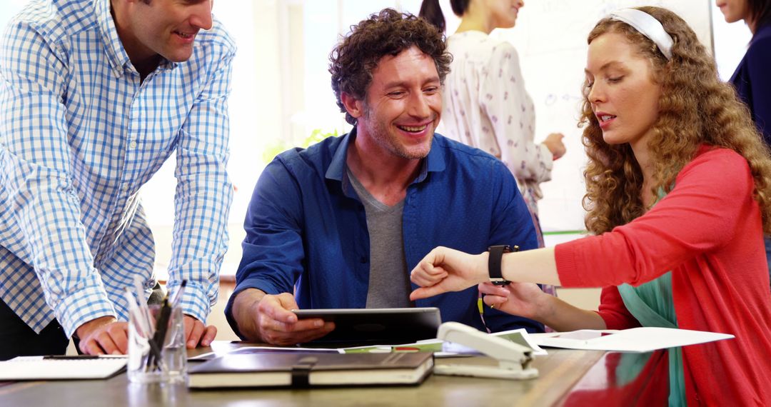 Diverse Team Collaborating with Technology in Office