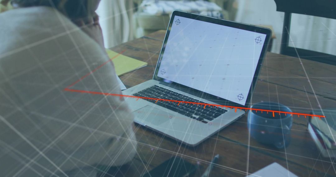 Woman Analyzing Data on Laptop with Virtual Overlay