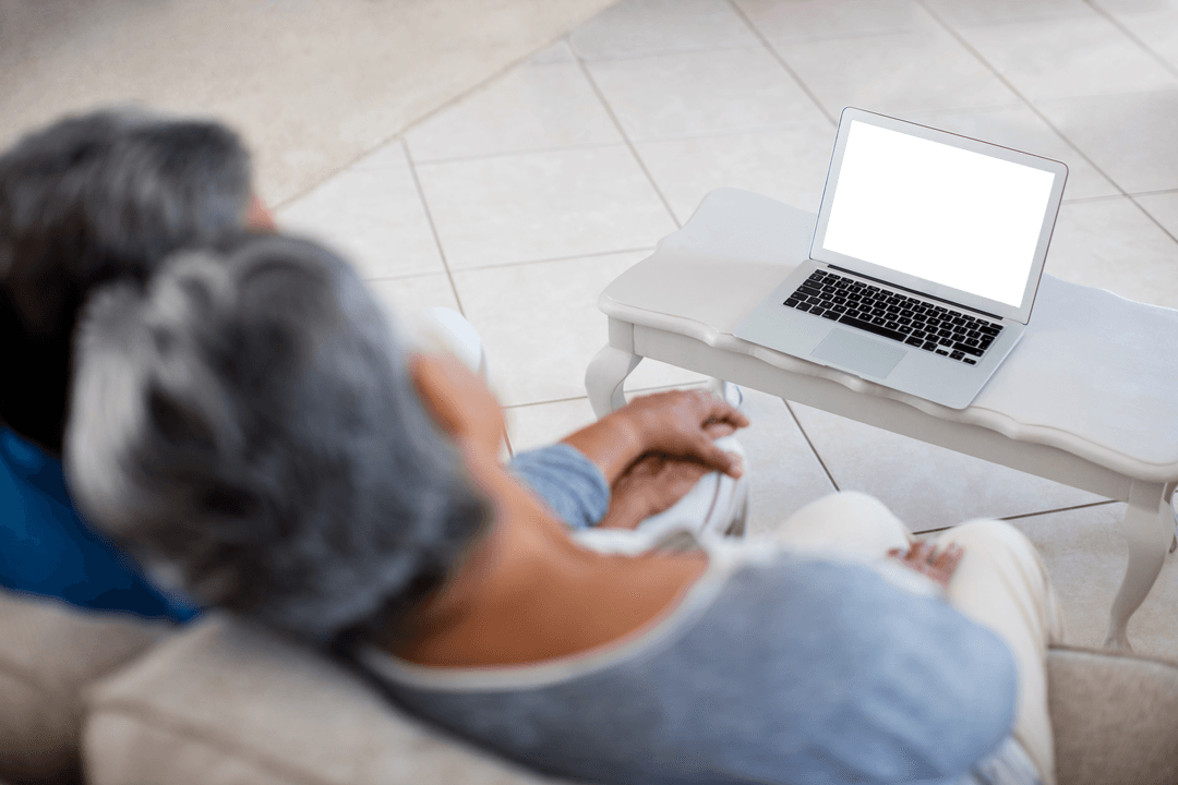 Senior Couple Communicating with Blank Transparent Laptop Screen