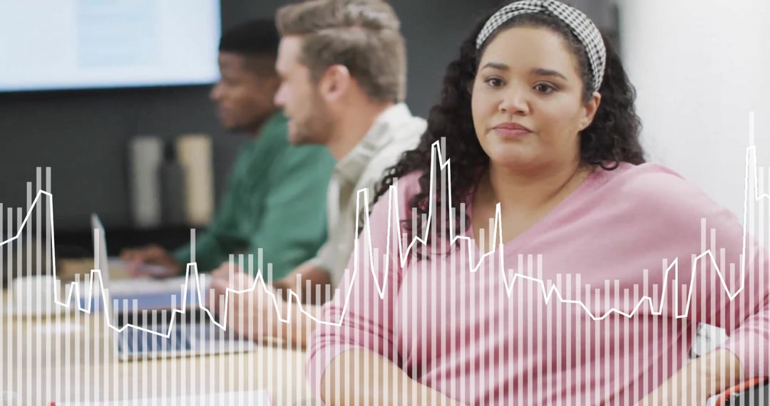 Diverse Team Processing Data in Modern Office Meeting