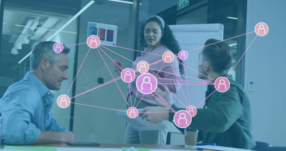 Team Analyzing Network Diagram in Modern Office Environment