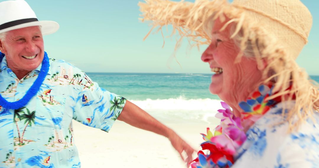 Happy Senior Couple Enjoying Tropical Beach Vacation - Free Images, Stock Photos and Pictures on Pikwizard.com