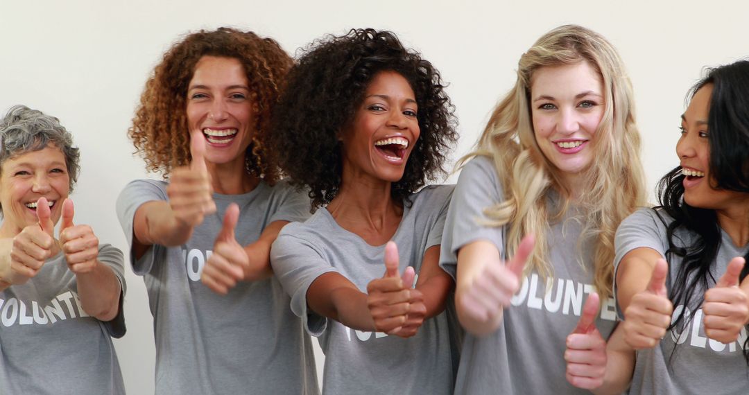 Diverse Group of Female Volunteers Smiling and Giving Thumbs Up - Free Images, Stock Photos and Pictures on Pikwizard.com