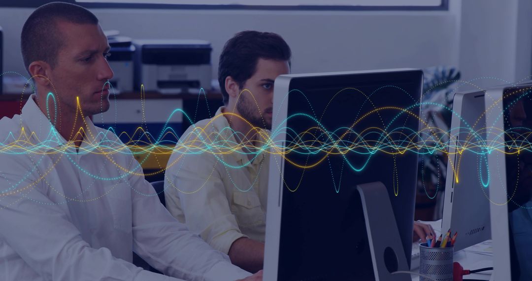 Coworkers Collaborating on Technology with Digital Waveforms Overlay